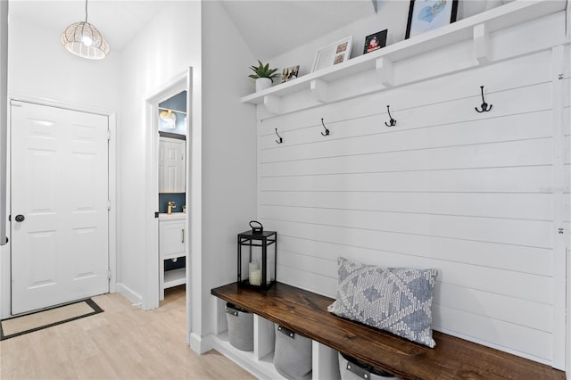 mudroom with light wood-style flooring