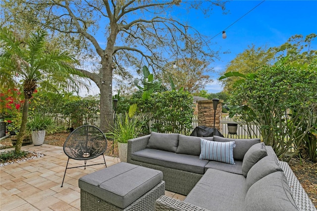 view of patio / terrace featuring an outdoor hangout area and fence