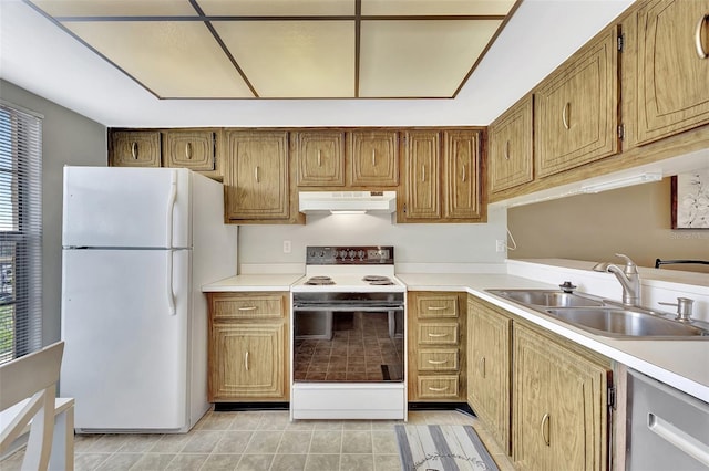 kitchen featuring white appliances, light tile patterned floors, a sink, light countertops, and under cabinet range hood