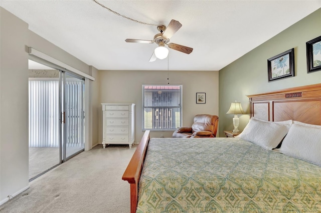 bedroom with access to exterior, baseboards, a ceiling fan, and carpet