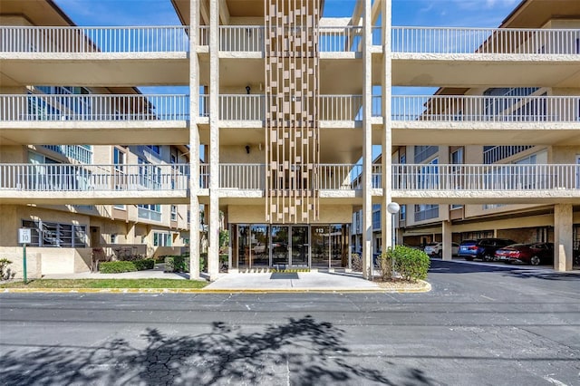 view of property with covered parking