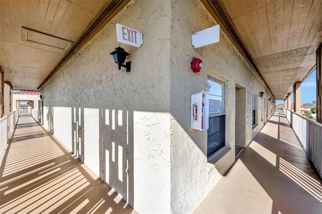 exterior space featuring a balcony and stucco siding