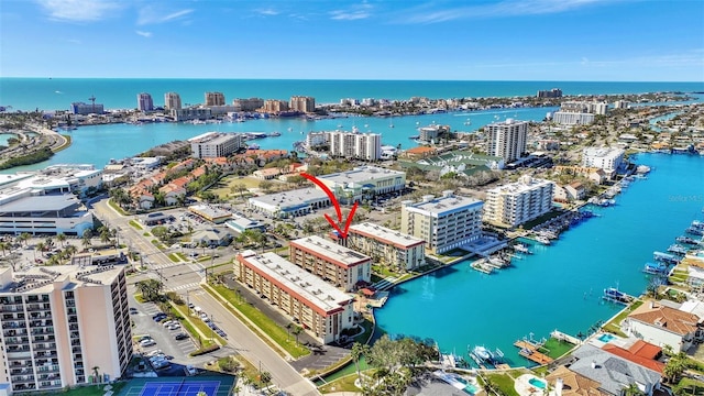 drone / aerial view with a city view and a water view