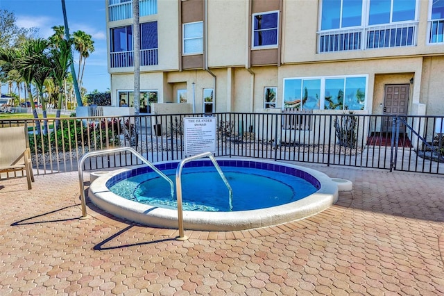 view of swimming pool with fence