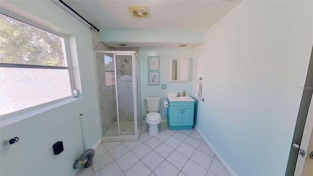 full bath featuring toilet, a shower stall, vanity, a textured ceiling, and tile patterned floors