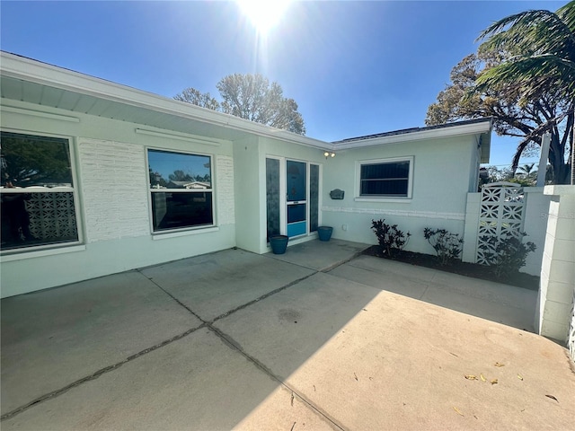 rear view of property with a patio area