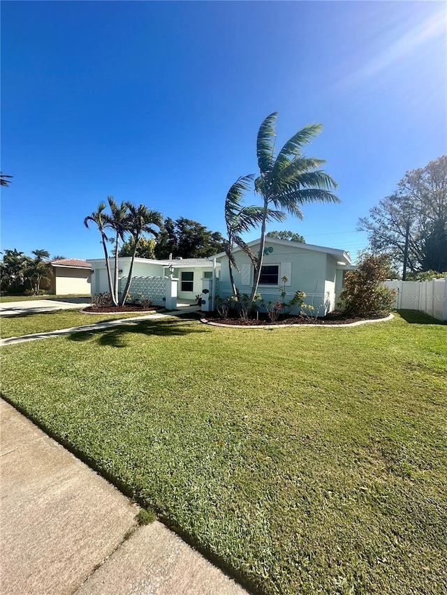 view of front of property with fence and a front yard