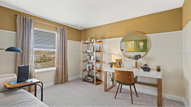 carpeted home office featuring baseboards