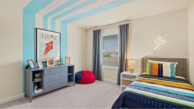 carpeted bedroom with baseboards