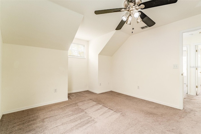 additional living space with lofted ceiling, carpet flooring, and visible vents