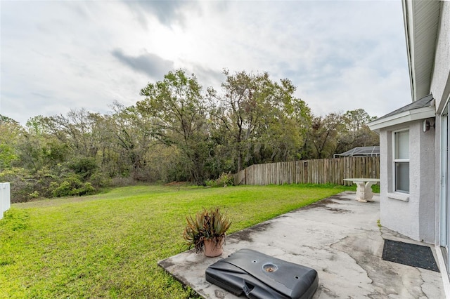 view of yard featuring a patio area and fence