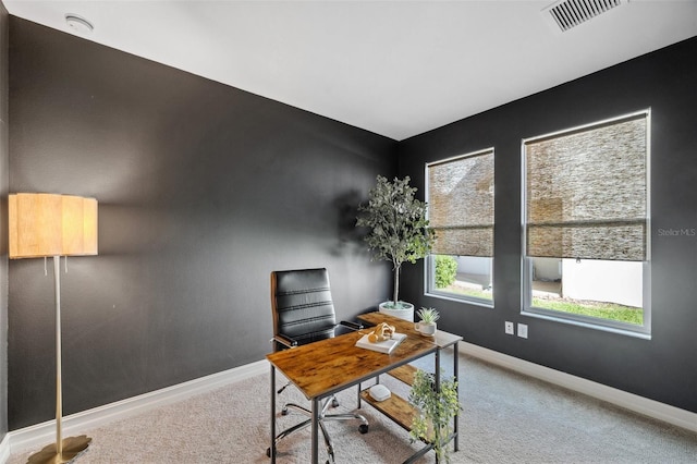 carpeted home office with baseboards and visible vents