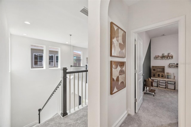 corridor featuring carpet, recessed lighting, visible vents, an upstairs landing, and baseboards