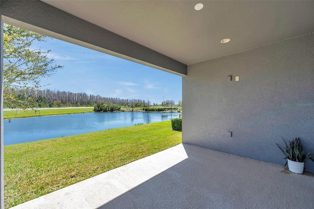 view of patio with a water view