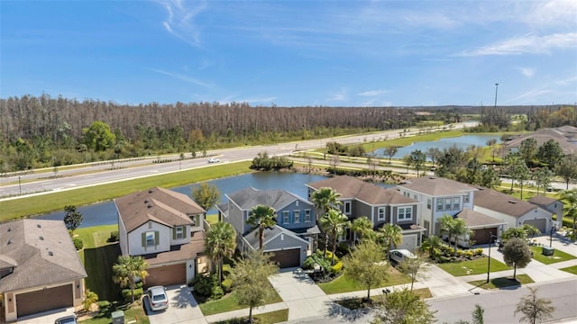 bird's eye view with a water view and a residential view