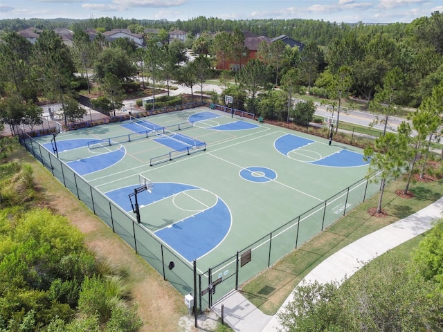 view of basketball court featuring community basketball court and fence