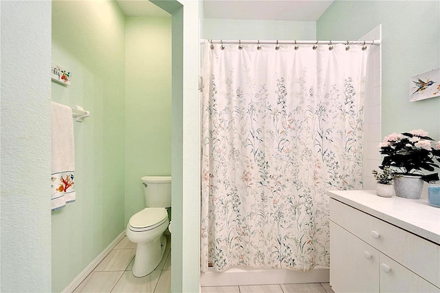 full bath featuring tile patterned flooring, curtained shower, and toilet