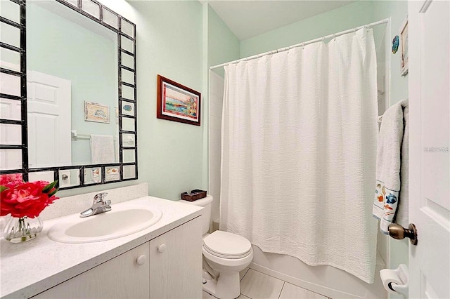 full bath featuring tile patterned floors, shower / bathtub combination with curtain, toilet, and vanity