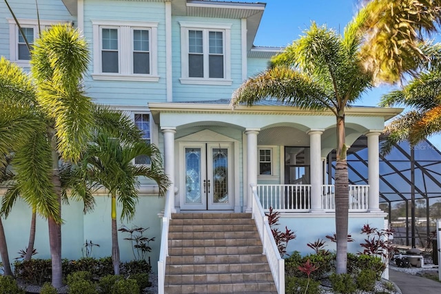 view of front facade with stairway and french doors