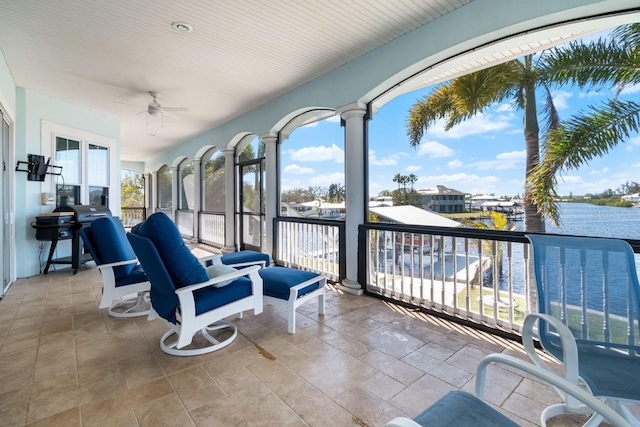 sunroom with a ceiling fan