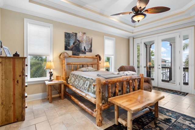 bedroom featuring baseboards, crown molding, french doors, a raised ceiling, and access to outside