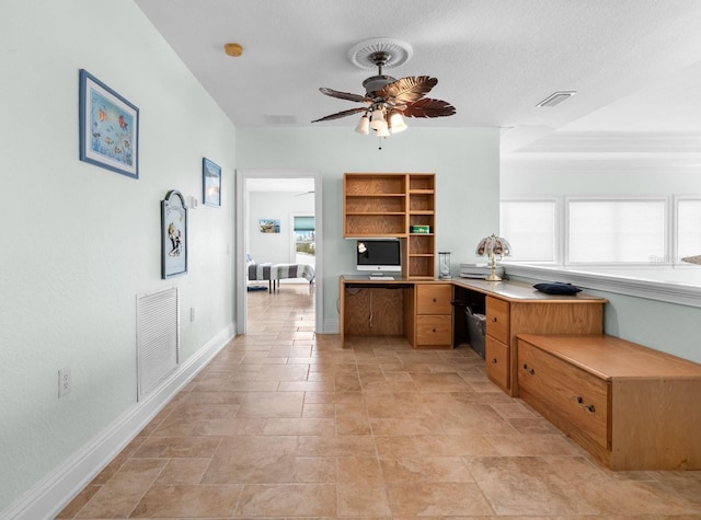 office with visible vents, baseboards, and ceiling fan