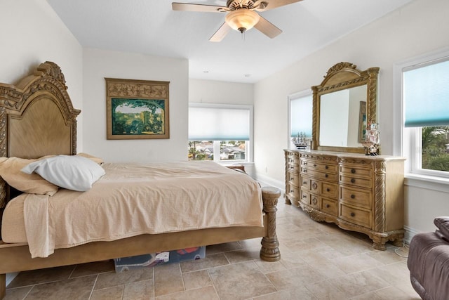 bedroom featuring baseboards and a ceiling fan