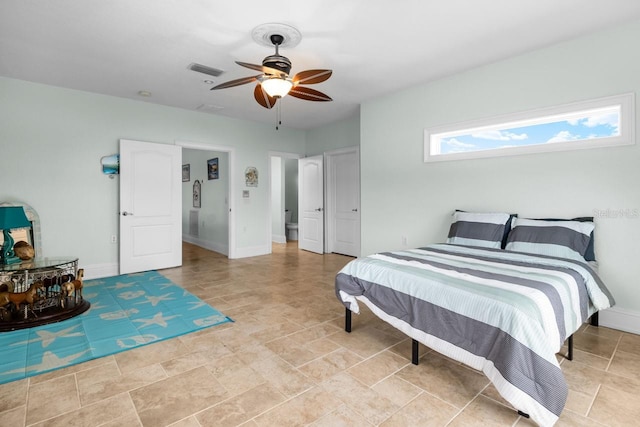 bedroom with visible vents, baseboards, and a ceiling fan