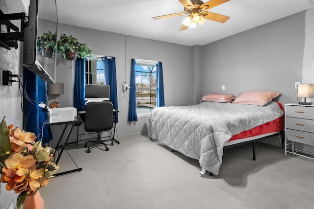 bedroom with a ceiling fan and carpet floors