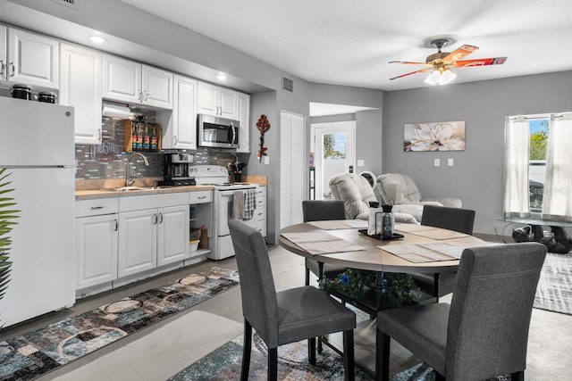 dining space with visible vents and a ceiling fan