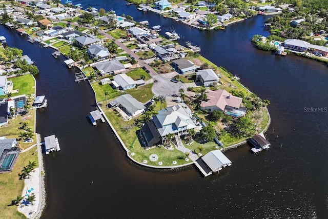 drone / aerial view featuring a residential view and a water view