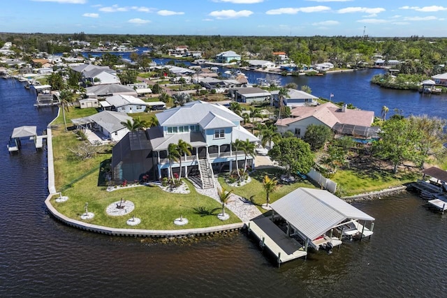 aerial view with a water view and a residential view