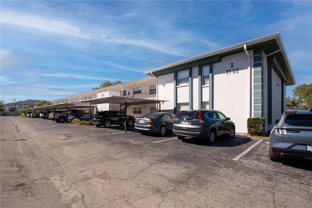 view of partially covered parking lot