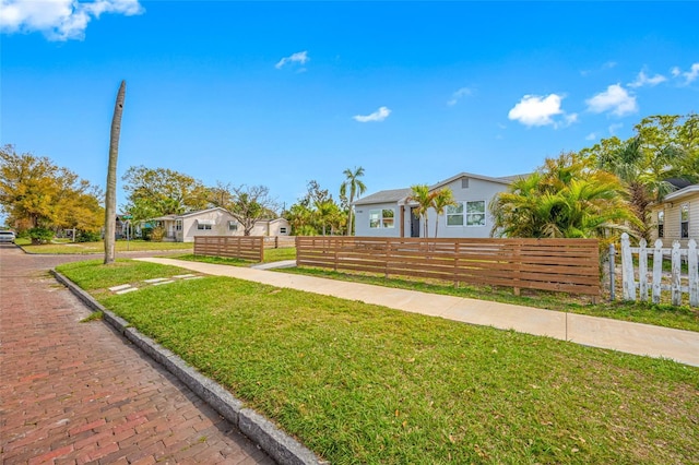 view of front of home featuring a fenced front yard and a front yard