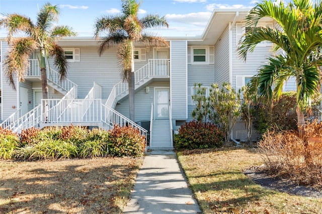 view of property featuring stairway