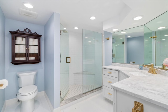 full bathroom featuring tile patterned flooring, toilet, vanity, baseboards, and a stall shower