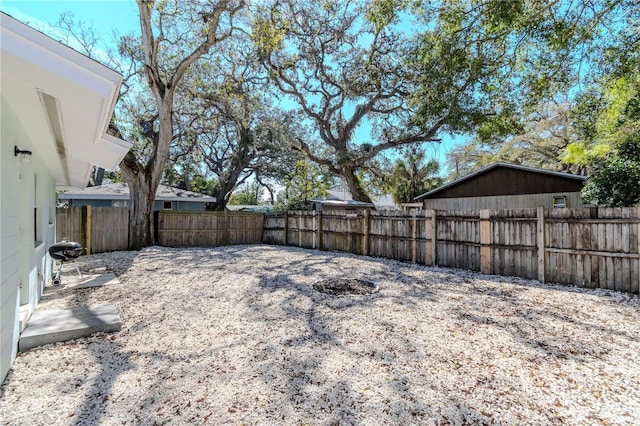 view of yard with a fenced backyard