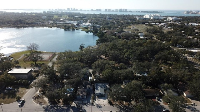 birds eye view of property with a water view and a city view