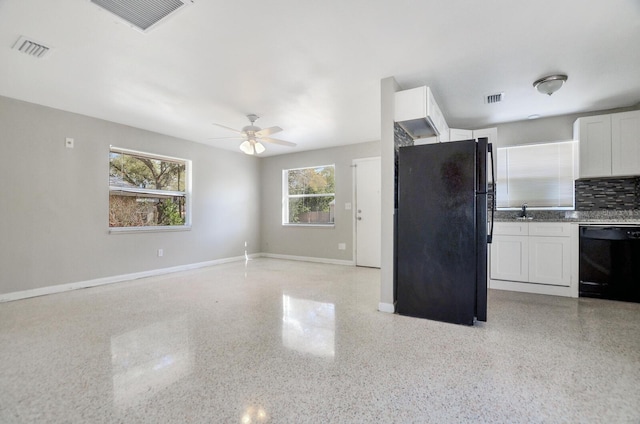 kitchen featuring black appliances, visible vents, and white cabinets