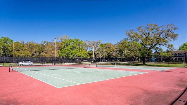 view of sport court with community basketball court and fence