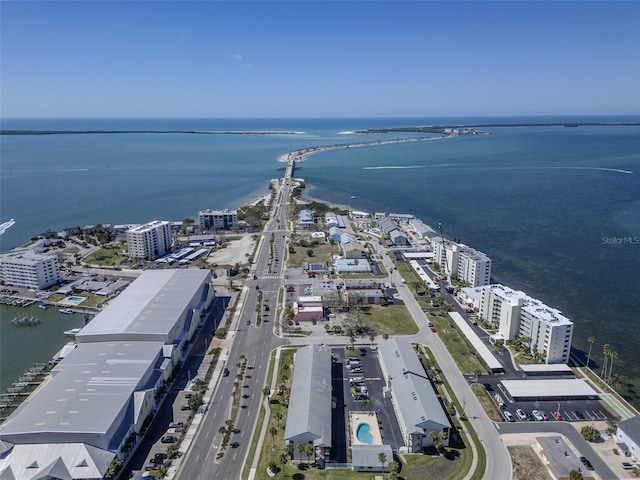 birds eye view of property featuring a water view and a city view