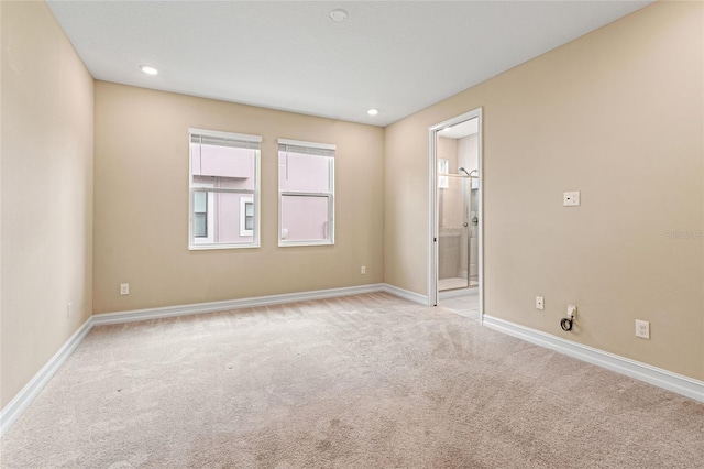 carpeted empty room with recessed lighting and baseboards