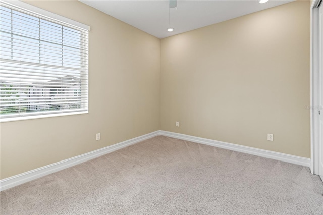 unfurnished room featuring recessed lighting, light carpet, ceiling fan, and baseboards