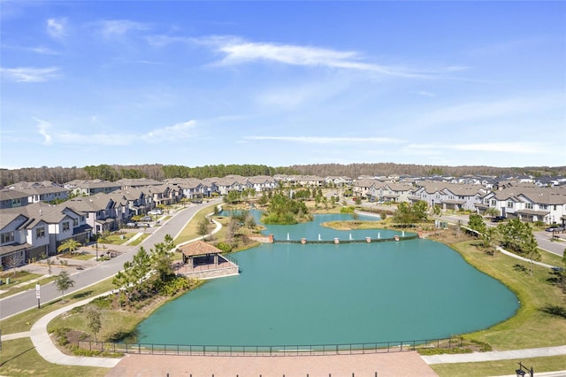 bird's eye view featuring a water view and a residential view