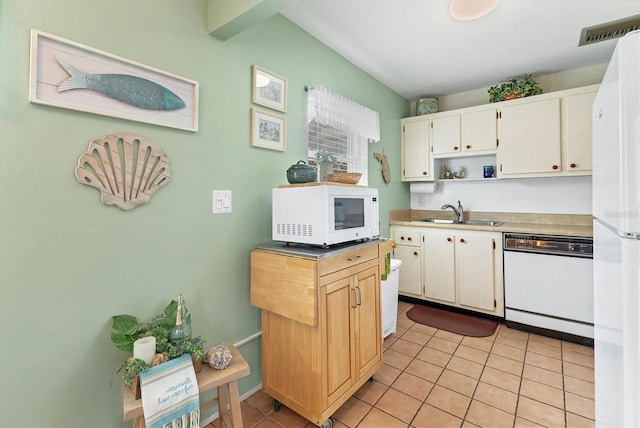 kitchen featuring visible vents, a sink, open shelves, white appliances, and light tile patterned floors