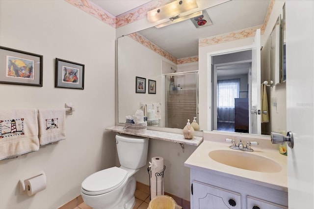 full bath with vanity, a shower stall, and toilet