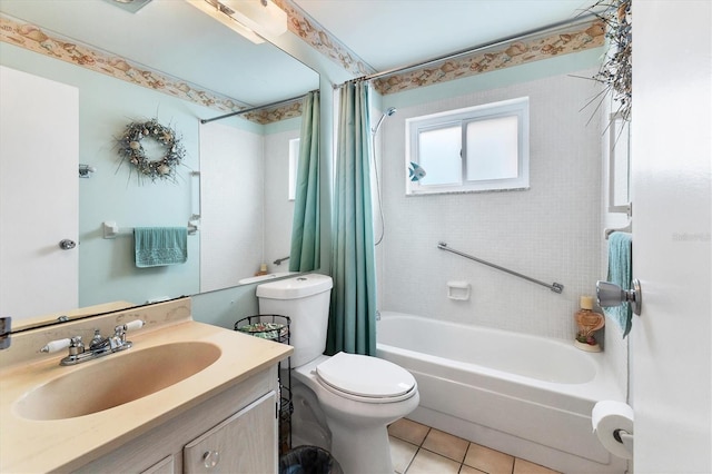 bathroom featuring tile patterned floors, toilet, shower / bath combo with shower curtain, and vanity