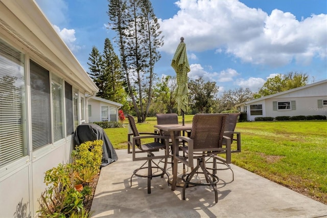 view of patio featuring outdoor dining space and a grill