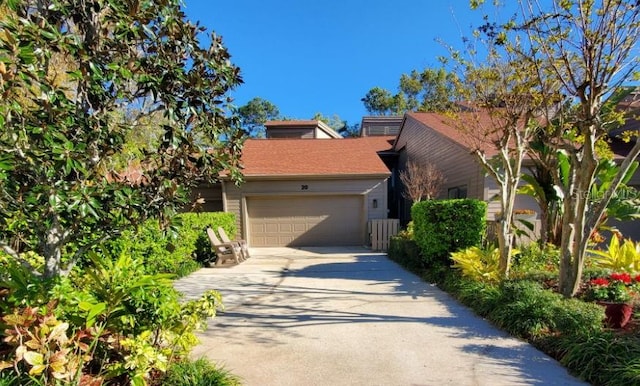 view of front of home featuring a garage and concrete driveway