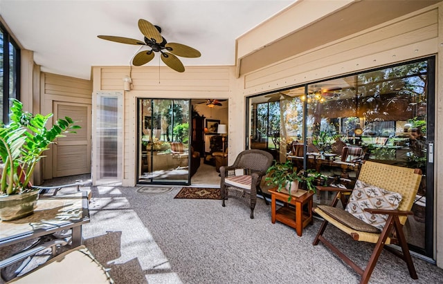 sunroom featuring a ceiling fan and a wealth of natural light